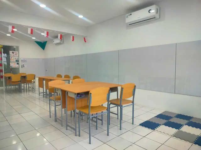 Learning tables and chairs arranged in a bright room